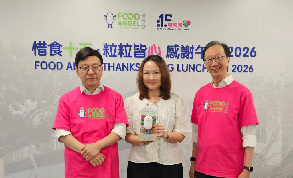 FreeComm director Candy Chui with Food Angel representatives at the 15th anniversary Thanksgiving Luncheon